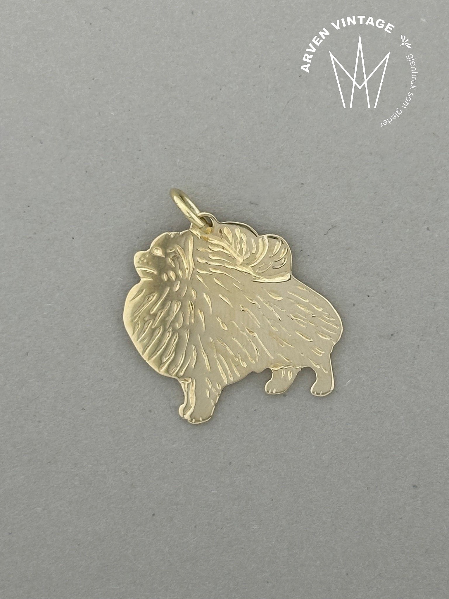 Vintage gold pendant with dog motif