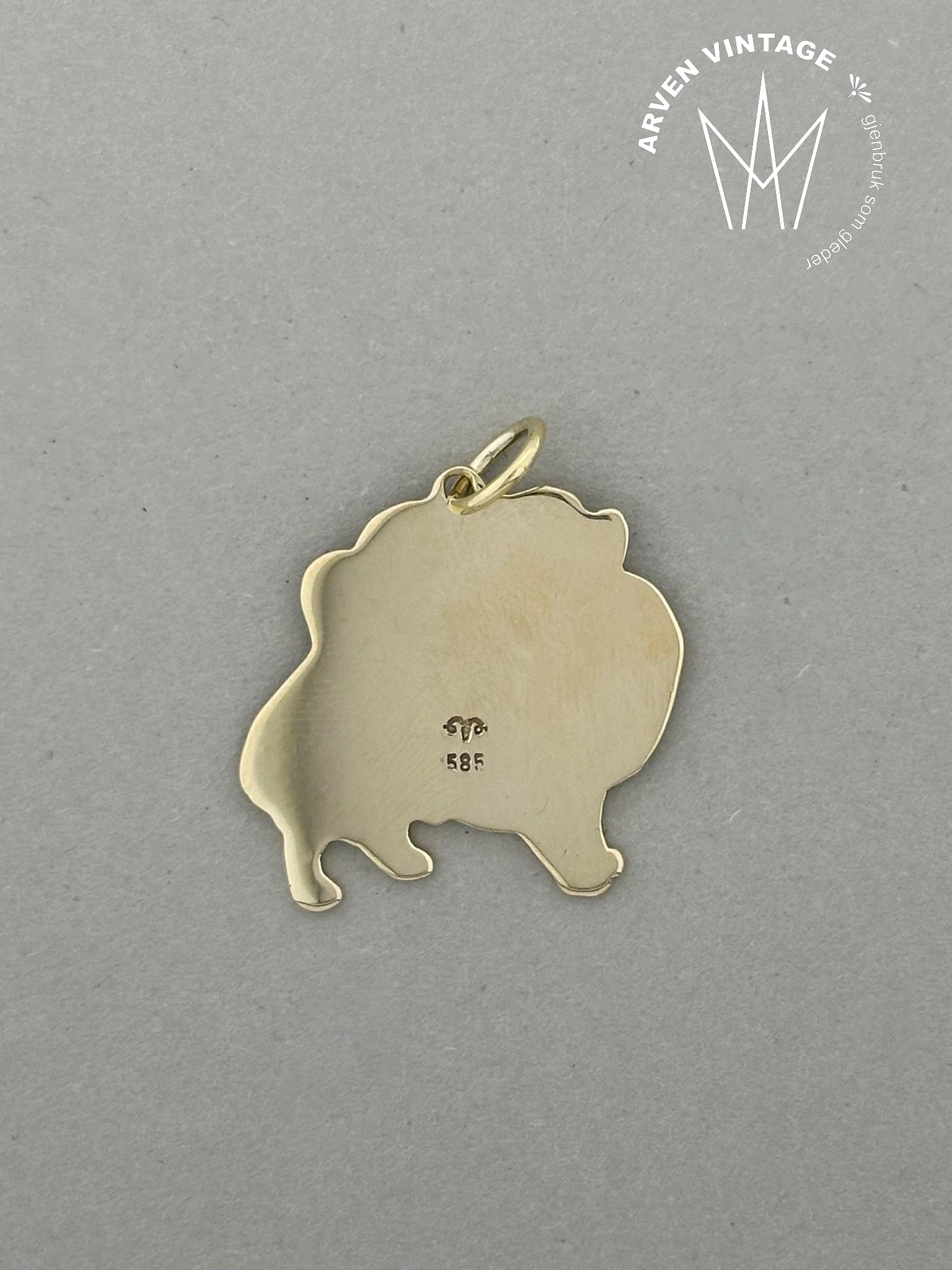 Vintage gold pendant with dog motif