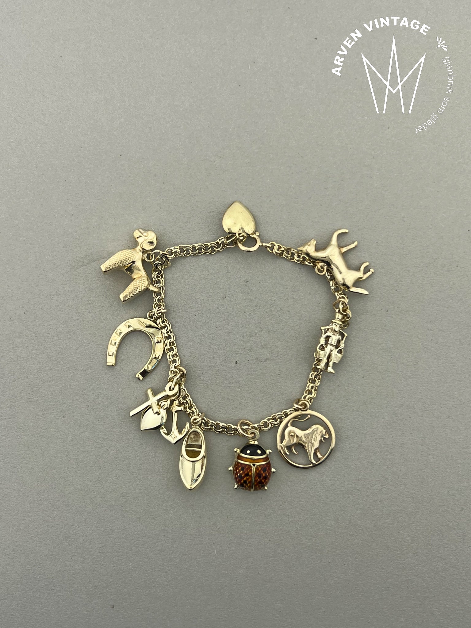 Vintage charmsarmbånd gult gull 16cm